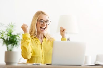 Great Result. Overjoyed Mature Woman Celebrating Success, Looking At Laptop